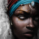 A young African woman with markings on her face and silver eyes gazes out from the book cover of Children of Virtue and Vengeance.